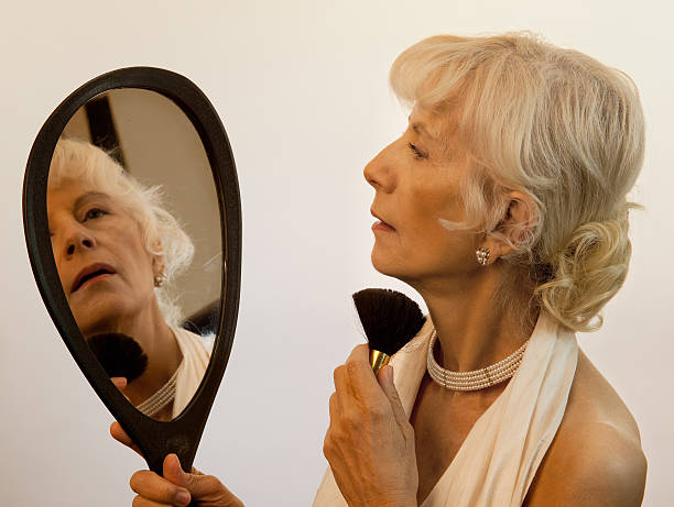 istock Senior Adult Applying Make-Up 467688987