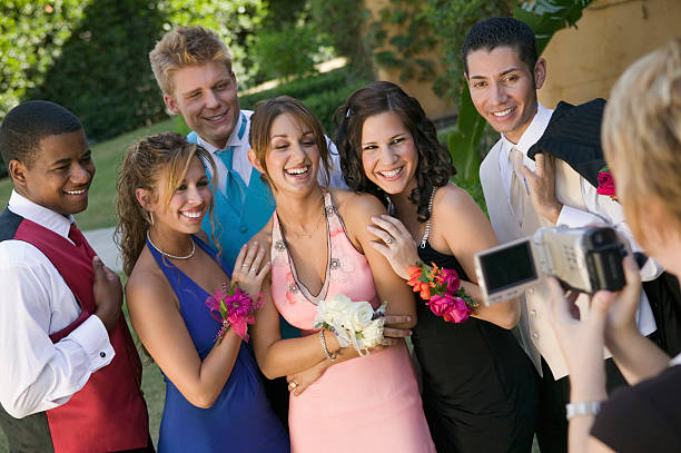 istock Group of Friends Being Videotaped at Prom 467689667