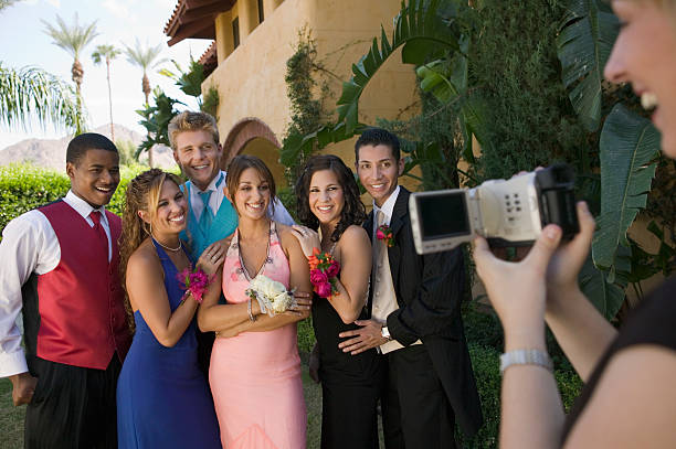 istock Group of Friends Being Videotaped at Prom 467689713