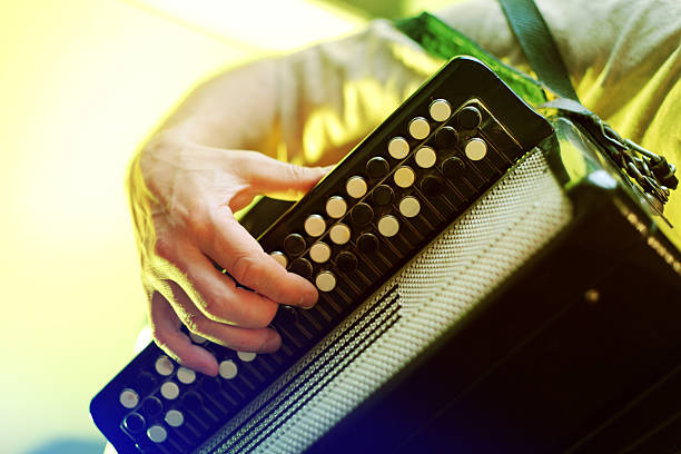 Image of musician playing on accordion closeup stock photo