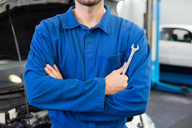 istock Mechanic standing with arms crossed 467693994