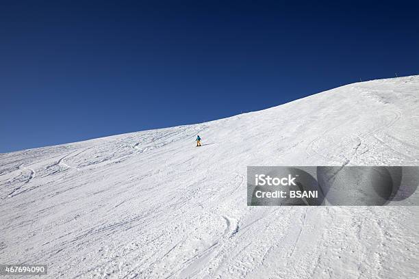 Skier On Slope In Sun Day Stock Photo - Download Image Now - 2015, Activity, Adult