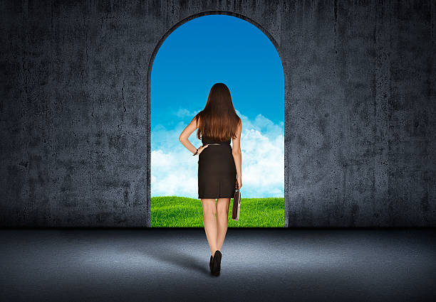 istock Girl with a leather briefcase is the arch 467694108