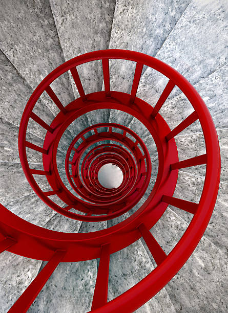 istock Spiral stairs with red balustrade 467694238