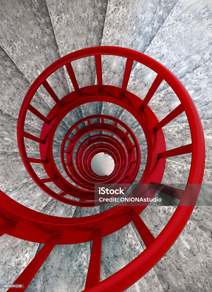 Spiral stairs with red balustrade Spiral stone stairs with red painted balustrade, view from top Red Stock Photo