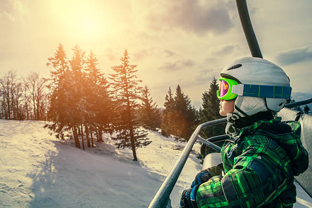 Little skier on the ski lift