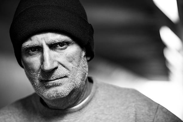 istock Homeless senior man with beard in subway tunnel 467697188