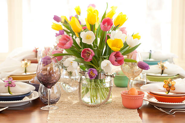 istock Easter elegant dining table and a centerpiece vase of tulips 467697468