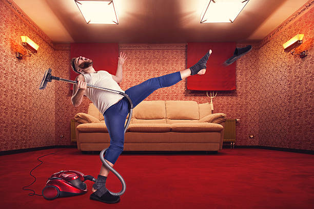 istock Adult man dancing withvacuum cleaner 467697510
