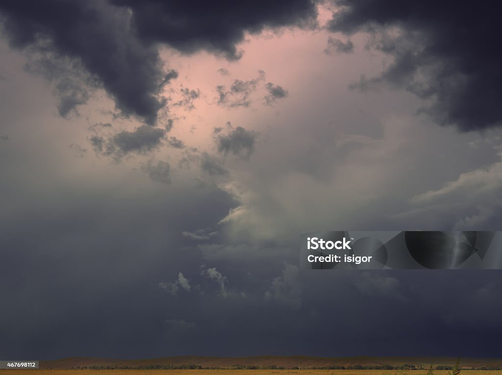 Hazy Clouds before storm. Horizon shrouded in darkness and mist. 2015 Stock Photo