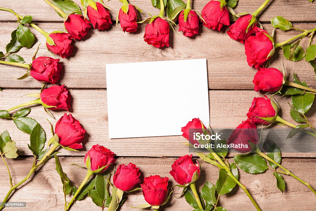 Frame of fresh roses Frame of fresh roses arranged on old wooden background 2015 Stock Photo
