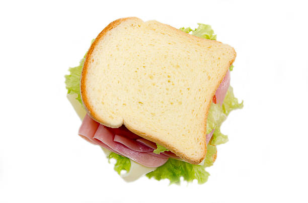 istock Slices of bread with ham and salad from above 467700352