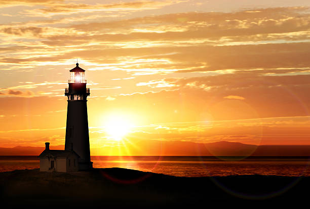 Lighthouse at sunset stock photo