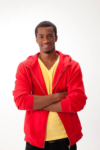 istock A smiling young man wearing a red vest isolated on white 467703285