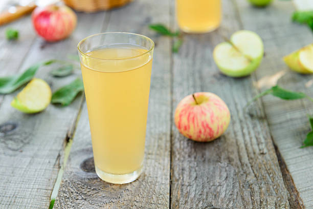 Fresh homemade apple juice and apples Fresh homemade apple juice and apples apple juice photos stock pictures, royalty-free photos & images