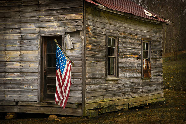 istock USA Flag Hangs From an Old Cabin Horizontal 467705186