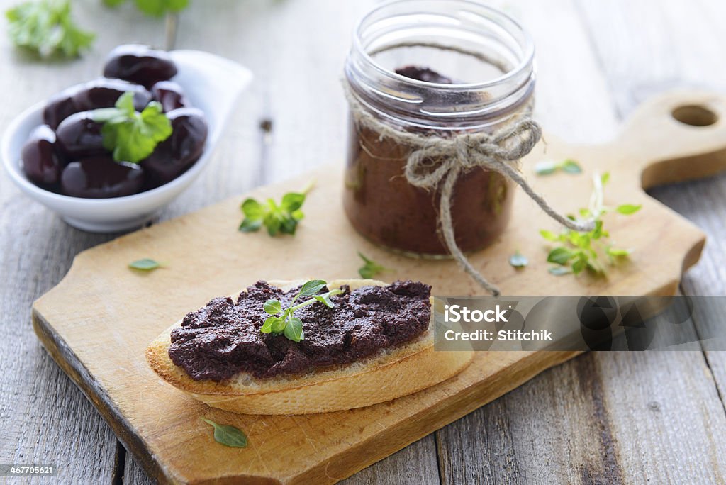 Toast with paste from black olives and basil Appetizer Stock Photo