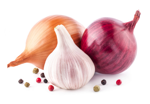 Garlic and onion with parsley isolated on white background