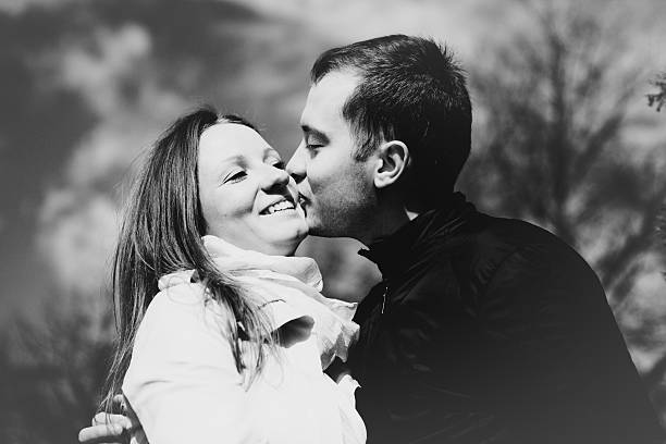 istock Young happy couple kissing B&W 467706506