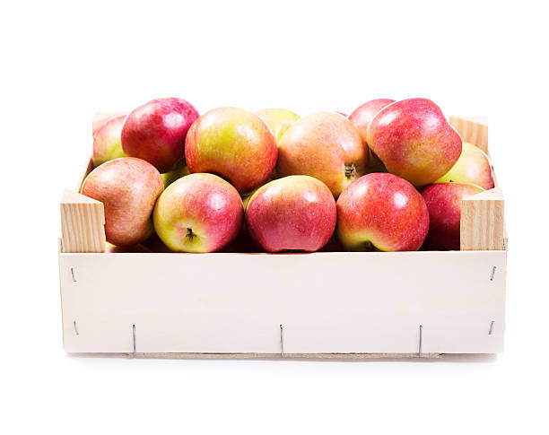 istock red apples in wooden box 467706872