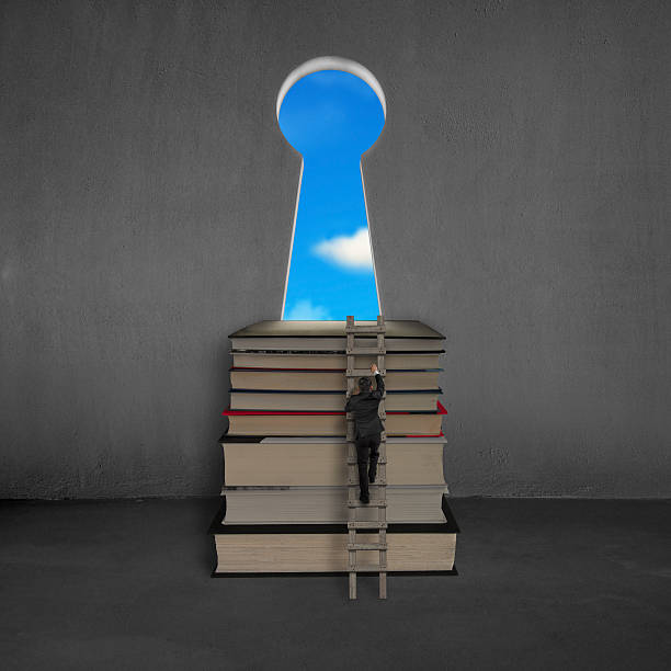 istock Businessman approaching books top with key shape door, blue sky 467707039