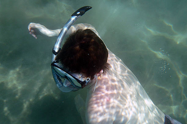 istock Man swimming underwater in zante greece 467707757