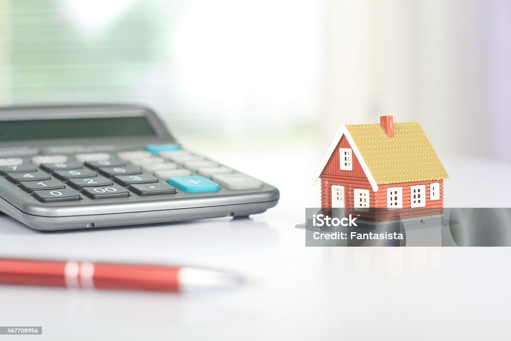 Real estate investment Real estate investment. House and calculator on table. 2015 Stock Photo