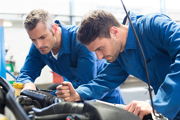 istock Team of mechanics working together 467709164