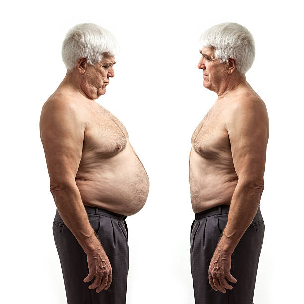 Overweight and regular weight men over white stock photo