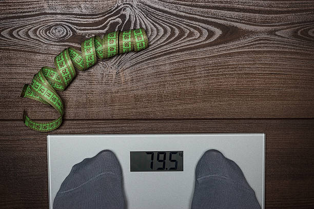 istock electronic scales on the wooden floor dieting concept 467710837