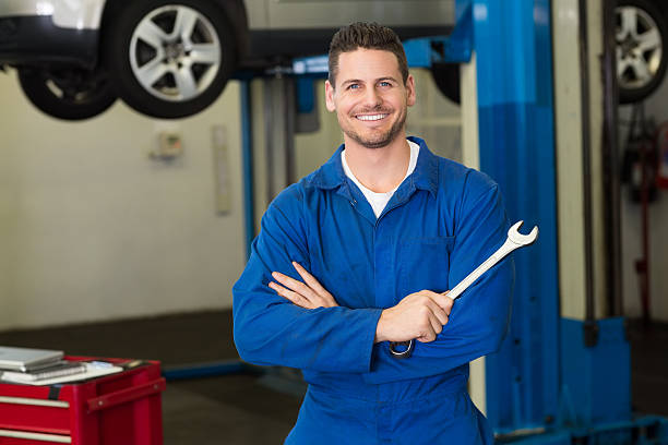 istock Mechanic smiling at the camera 467712004