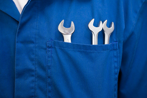 Group of various work tools on gray background.