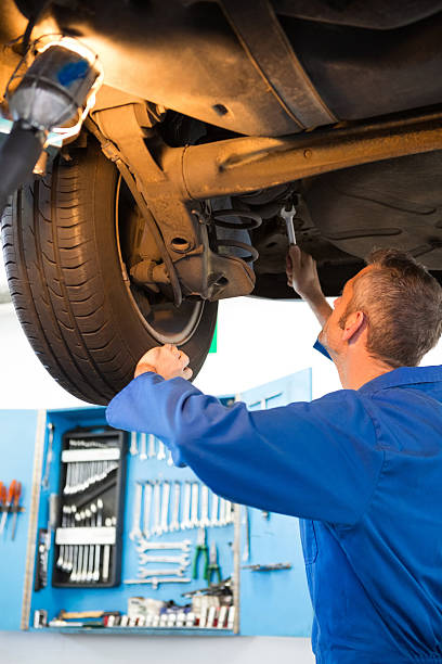 istock Mechanic examining under the car 467713474