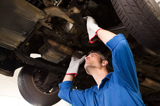 istock Mechanic examining under the car 467713486
