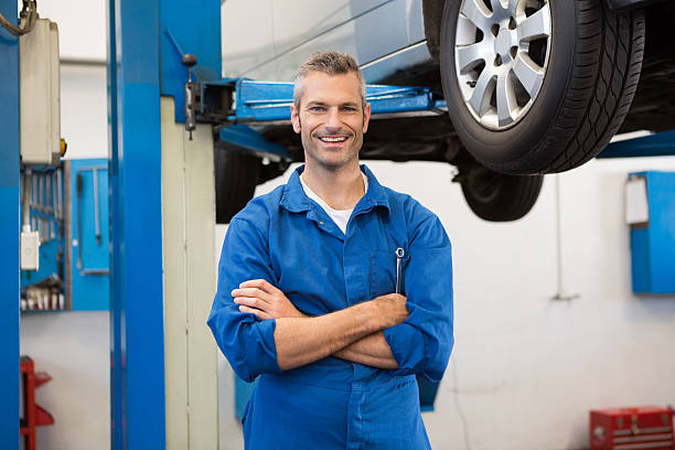 istock Mechanic smiling at the camera 467713618