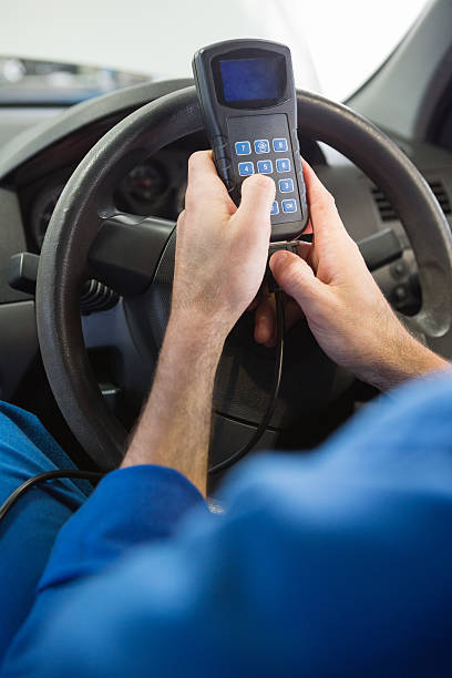 istock Mechanic using diagnostic tool in the car 467713762