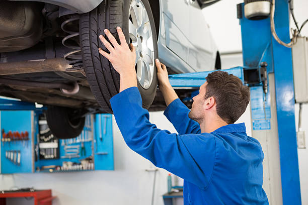 istock Mechanic adjusting the tire wheel 467713966