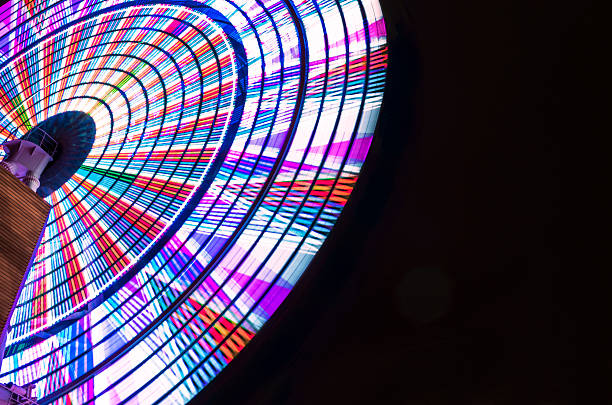 istock Bright Ferris Wheel Spinning Against Black Night Sky 467714472