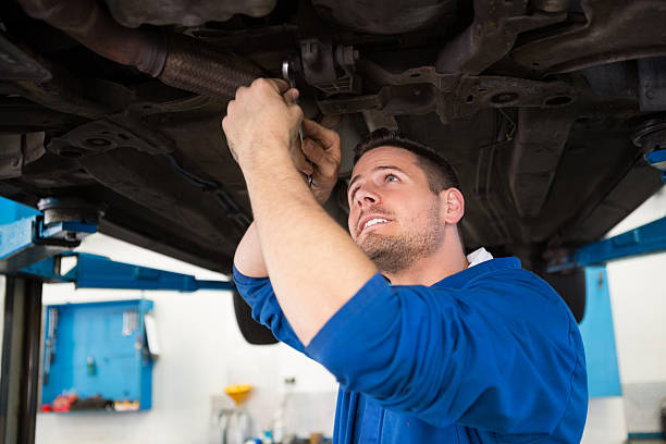 istock Mechanic examining under the car 467714688