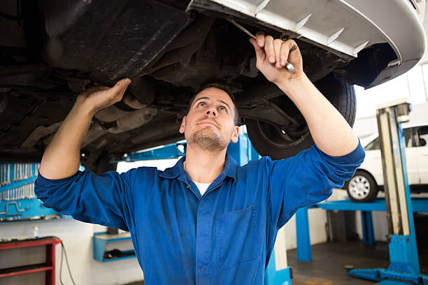 istock Mechanic examining under the car 467714804