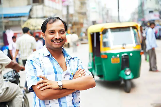 Indian auto rickshaw three-weeler tuk-tuk taxi driver man