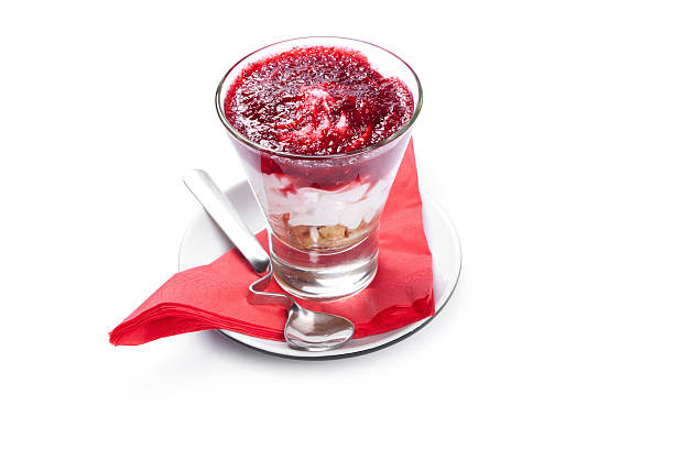 istock cheese cake in glass  isolated on white background 467715696