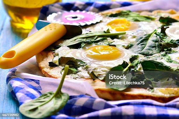 Pizza With Spinach And Fried Eggs Stock Photo - Download Image Now - Pizza, Recipe, 2015