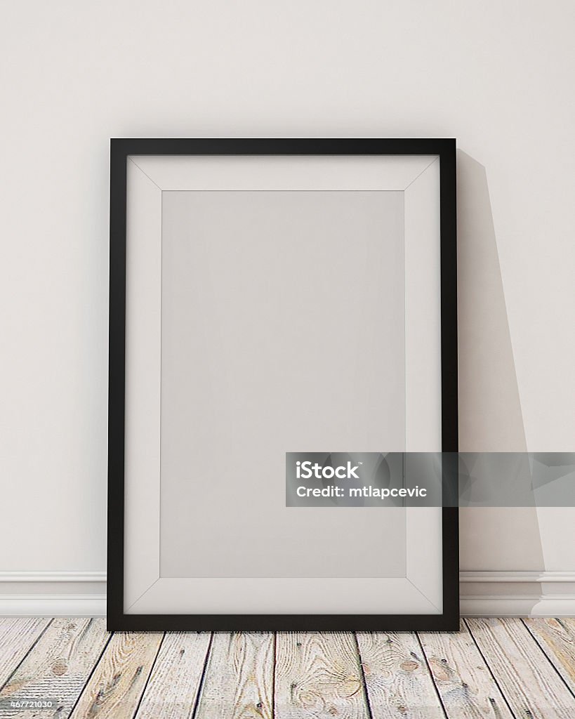 blank black picture frame on the wall and the floor 2015 Stock Photo