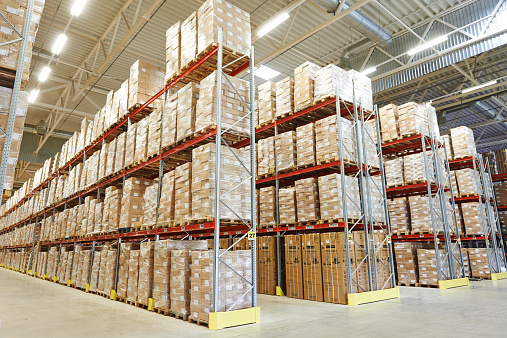 interior of modern warehouse. Rows of shelves with boxes