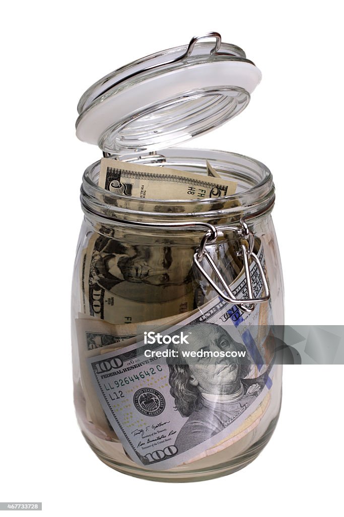 Money in the jar isolated on white background 2015 Stock Photo