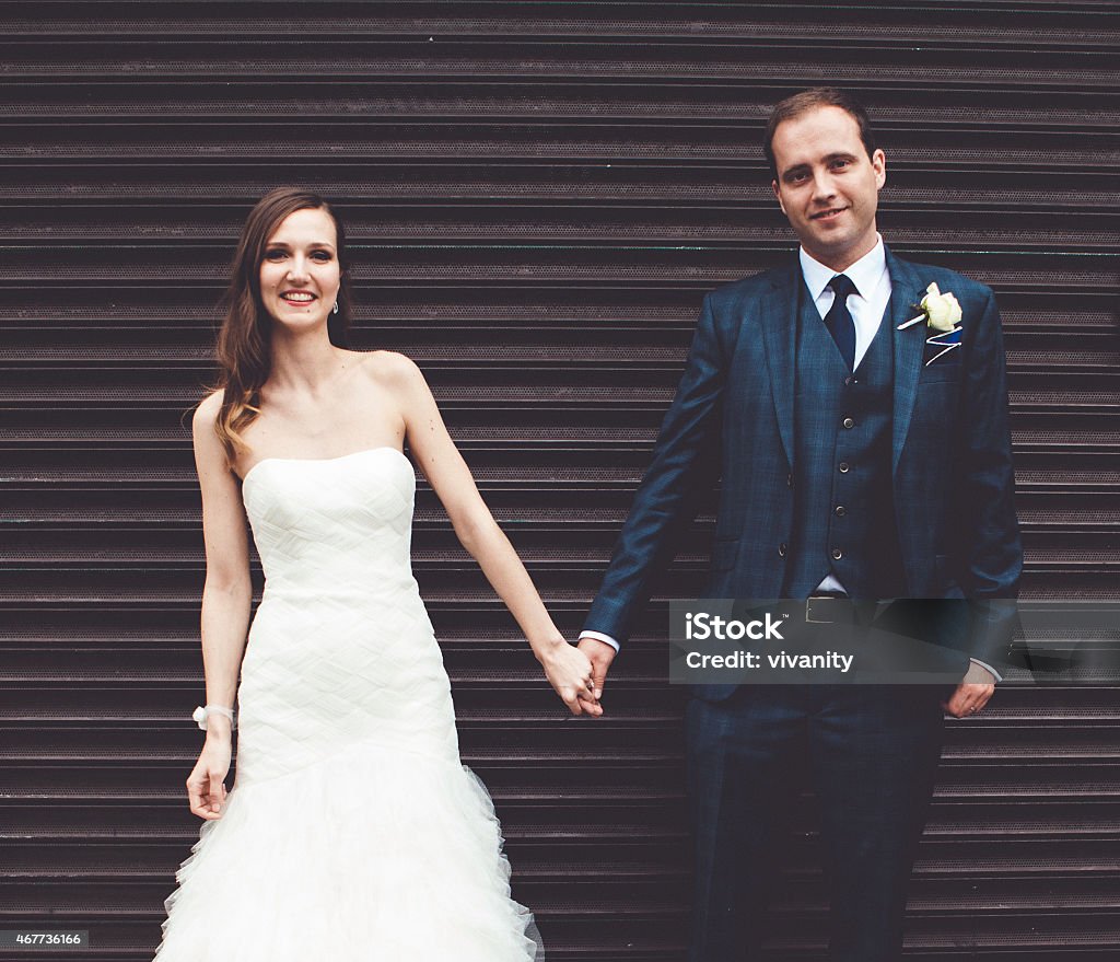 Bride and groom on the street For more wedding photos, please visit the lightbox below: 2015 Stock Photo