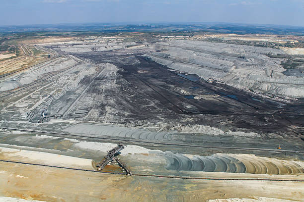 istock Large excavators in coal mine, aerial view 467740020