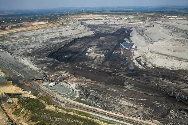 istock Large excavators in coal mine, aerial view 467740024