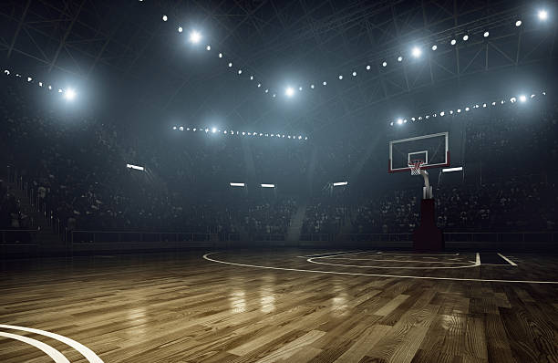 Basketball arena Indoor floodlit basketball arena full of spectators - full 3D court stock pictures, royalty-free photos & images